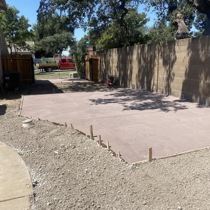 Excavated and graded subgrade with forms staked out ready for a pour